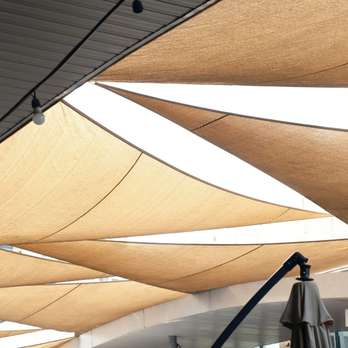 a group of umbrellas hanging from the ceiling of a building